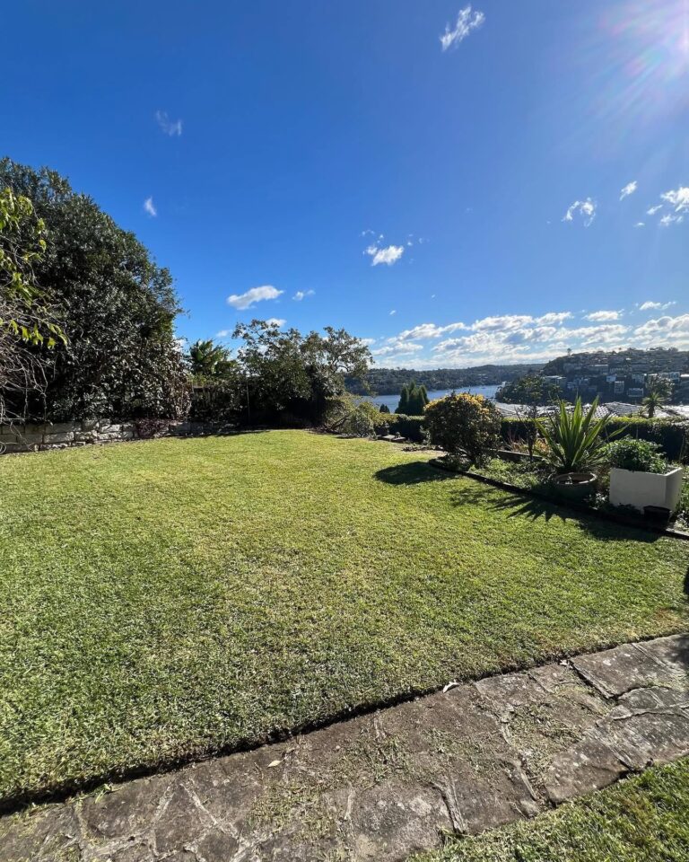 Established lawn and garden beds overlooking the water on Sydney's North Shore.